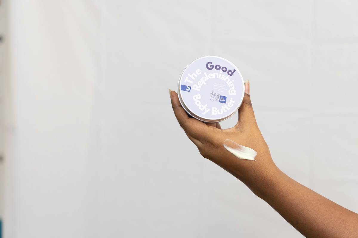 Woman applying sunscreen for sensitive skin body on arms without irritation