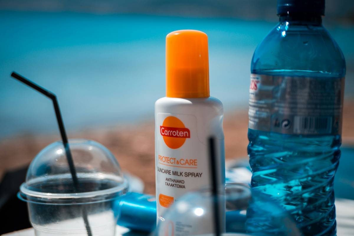bottle of skincare essential sunscreen skin that is reef-safe and non-greasy on bathroom counter